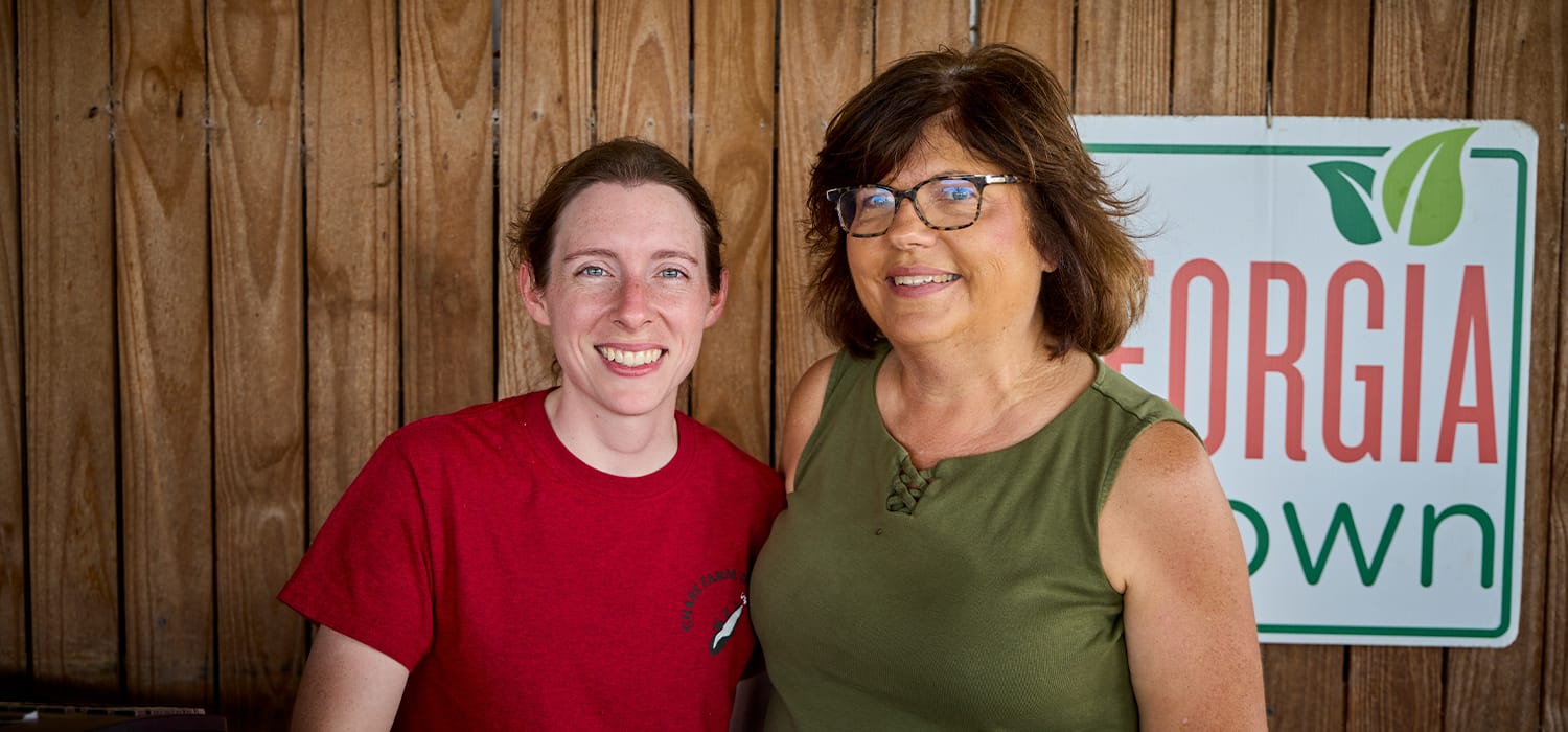 Michelle Chase and young worker from Chase Farms